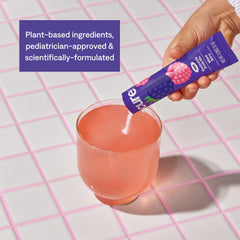 Cure Hydration glass of the mixed berry drink ready for sip after activity