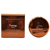 Open tub of Danessa Myricks Yummy Skin Blurring Balm Powder showing texture-smoothing formula.