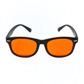 DefenderShield Kids blue light glasses with orange lenses for night use, promoting visual comfort.