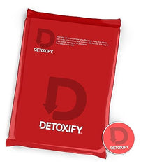 Detoxify Xxtra Clean bottle label highlights herbal ingredients and 20 oz size.