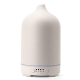 Diffuserlove ceramic diffuser 250ml with elegant cover for stylish bedroom aromatherapy.