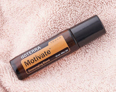 doTERRA Motivate Touch bottle with citrus notes highlighting fresh scent