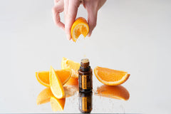 closeup of doTERRA Wild Orange oil label highlighting brand and purity