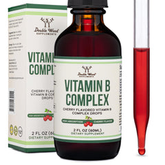 Pouring Double Wood cherry flavor B Complex drops into a glass for daily use.
