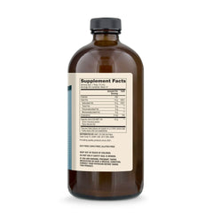 Pouring Dr. Mercola Biothin Ketone Energy MCT Oil for daily energy use