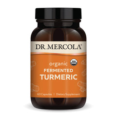Dr. Mercola Organic Fermented Turmeric bottle on a kitchen counter for daily antioxidant balance.