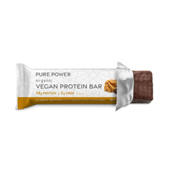 Hand-holding Dr. Mercola Pure Power Bar suggesting convenient on-the-go snack.