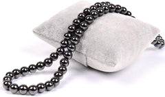 Drkao hematite necklace glossy black finish reflects light with a refined look.