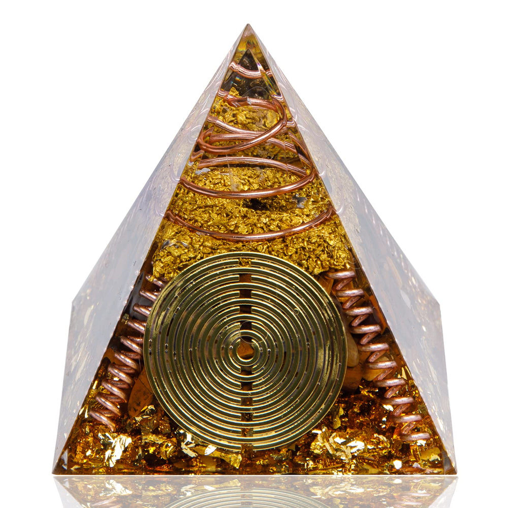 DRTMLY Orgone Pyramid with Tiger's Eye on desk for calm energy.