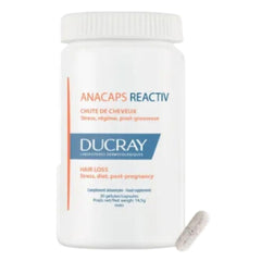 Ducray ANACAPS Reactiv capsules close-up highlighting soft texture and convenience.