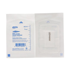 Dukal white nonwoven island dressing 2x3 laid flat beside packaging for easy application