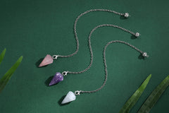 DUQGUHO rose quartz pendulum highlighting unconditional love in divination rituals.