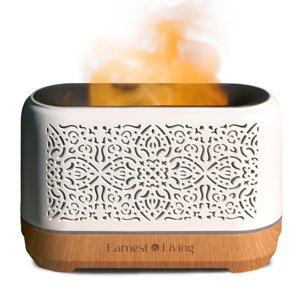 Earnest Living essential oil diffuser with flame night light creates cozy ambiance.