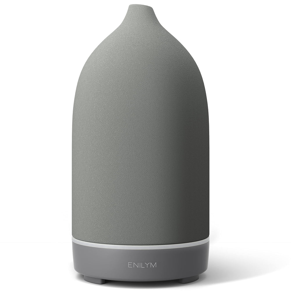 ENILYM aromatherapy diffuser in grey ceramic with a 9-color mood light for relaxing ambience.