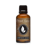 Eternal Essence Oils Warm Rustic Woods bottle close-up with dropper for precise blending.
