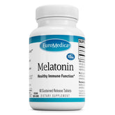 EuroMedica Melatonin bottle on nightstand suggests restful sleep support.