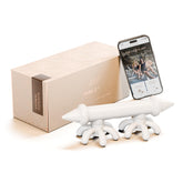 FasciaBlaster Mini 2 handheld massager on leg muscles for temporary relief