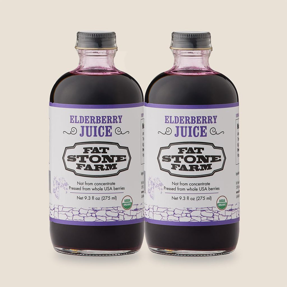 Fat Stone Farm elderberry juice bottle on kitchen counter, ready to mix beverages.