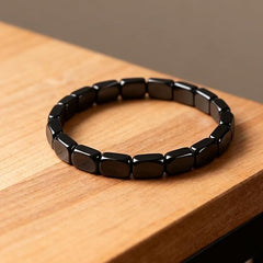 Fqwrus Hematite Bracelet stretch component close-up reveals durable nylon thread.