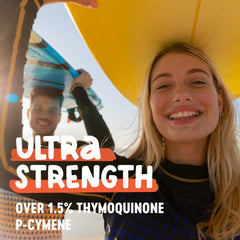 Pouring Freshfield Black Seed Oil into a dish