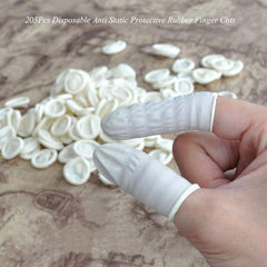 G2PLUS latex finger cots close-up material showing elasticity for better fit