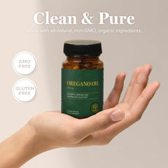 Global Healing Center oregano oil capsules in hand for on-the-go wellness.
