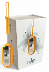 Glowco CalmCarry sleep aid device held in hand for portable calm on the go.
