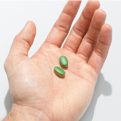 GNC Tri-Sleep packaging in dark tone conveys discreet relaxation at home.