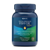 GNC Triple Strength Fish Oil mini softgels bottle on counter suggesting heart and brain support.