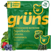 Grüns Super Greens Gummies bottle in strawberry flavor for daily nutrition.