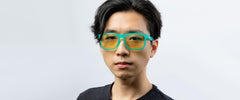 Gunnar amber-tint reading glasses side profile in emerald-green frame for daily wear.