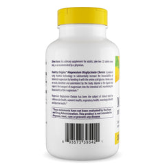 Close-up of Healthy Origins magnesium bisglycinate chelate tablets showing smooth capsules for gentle digestion.