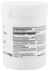 Heiltropfen Zeolite 240 capsules close-up showing ultrafine mineral powder texture.