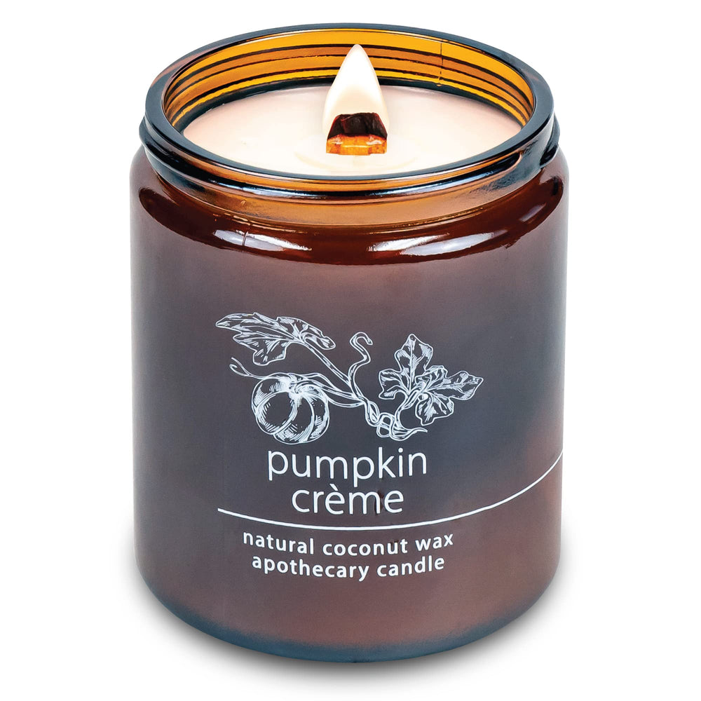 Hemlock Park Pumpkin Creme candle with crackling wood wick creating a cozy glow