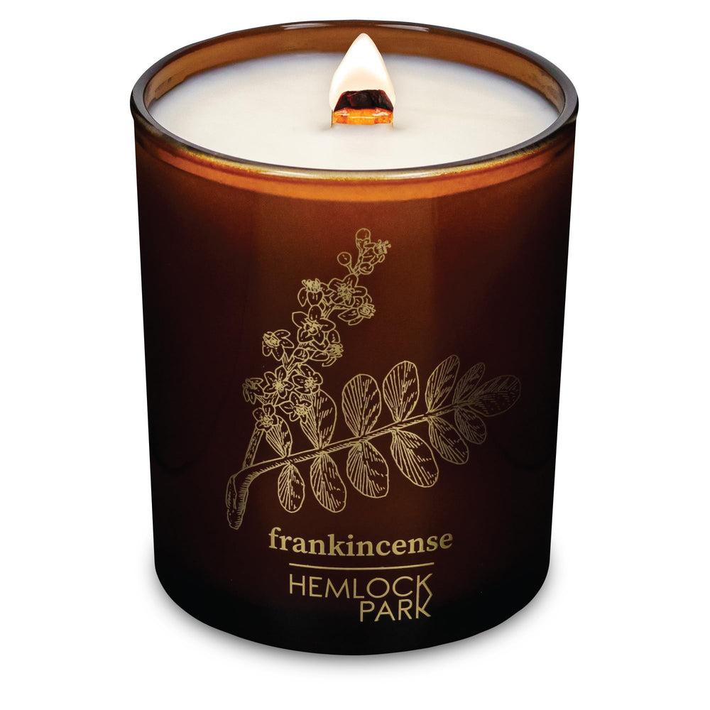 Hemlock Park frankincense candle with wood wick for calm ambience.