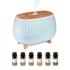 HŌM smart diffuser with aurora LED display creates calming, colorful ambience in any room.
