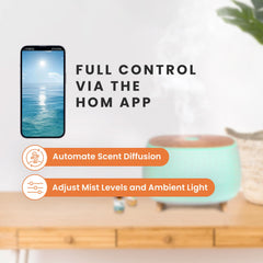 HŌM whisper-quiet ultrasonic diffuser emits a soft mist for peaceful spaces.