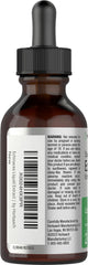 Horbaach Echinacea Drops dropper pouring into glass for convenient use.