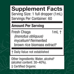Host Defense Chaga extract dropper dispensing into a glass for on-the-go routine