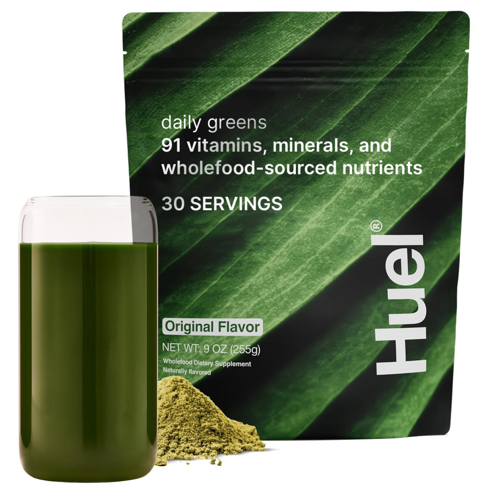 Huel Daily Greens bottle pour shows convenient daily supplementation for busy mornings.