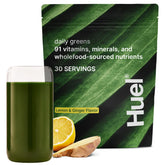 Huel Daily Greens powder scoop showing vibrant lemon-ginger blend for daily nutrient boost