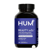 Hum Beauty zzZz melatonin bottle with label highlighting vegan sleep support for restful nights