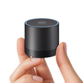 Hushing portable mini white noise machine, front view, ideal for travel-friendly sleep aid.