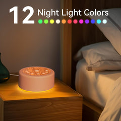 Hushing Sleep Sound Machine night lights show 12 colors for soothing ambiance.