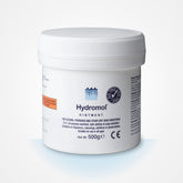 Hydromol Ointment 500g tub showing smooth texture for dry skin care.