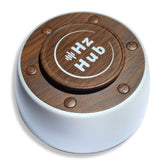 Hz Hub front view Solfeggio sound machine promotes meditation ambience.