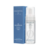 Inertia pH-balanced feminine wash bottle pour for easy daily cleansing.