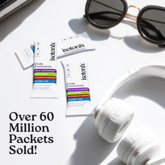 Isotonix Daily Essentials packet being poured into water for fast absorption.