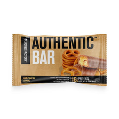 Jacked Factory Authentic Bar close-up with chocolate chips and honey, tasty real-food flavor.