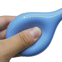 JIESI Rubber Suction Ear Syringe in action for dust removal on precision instruments.